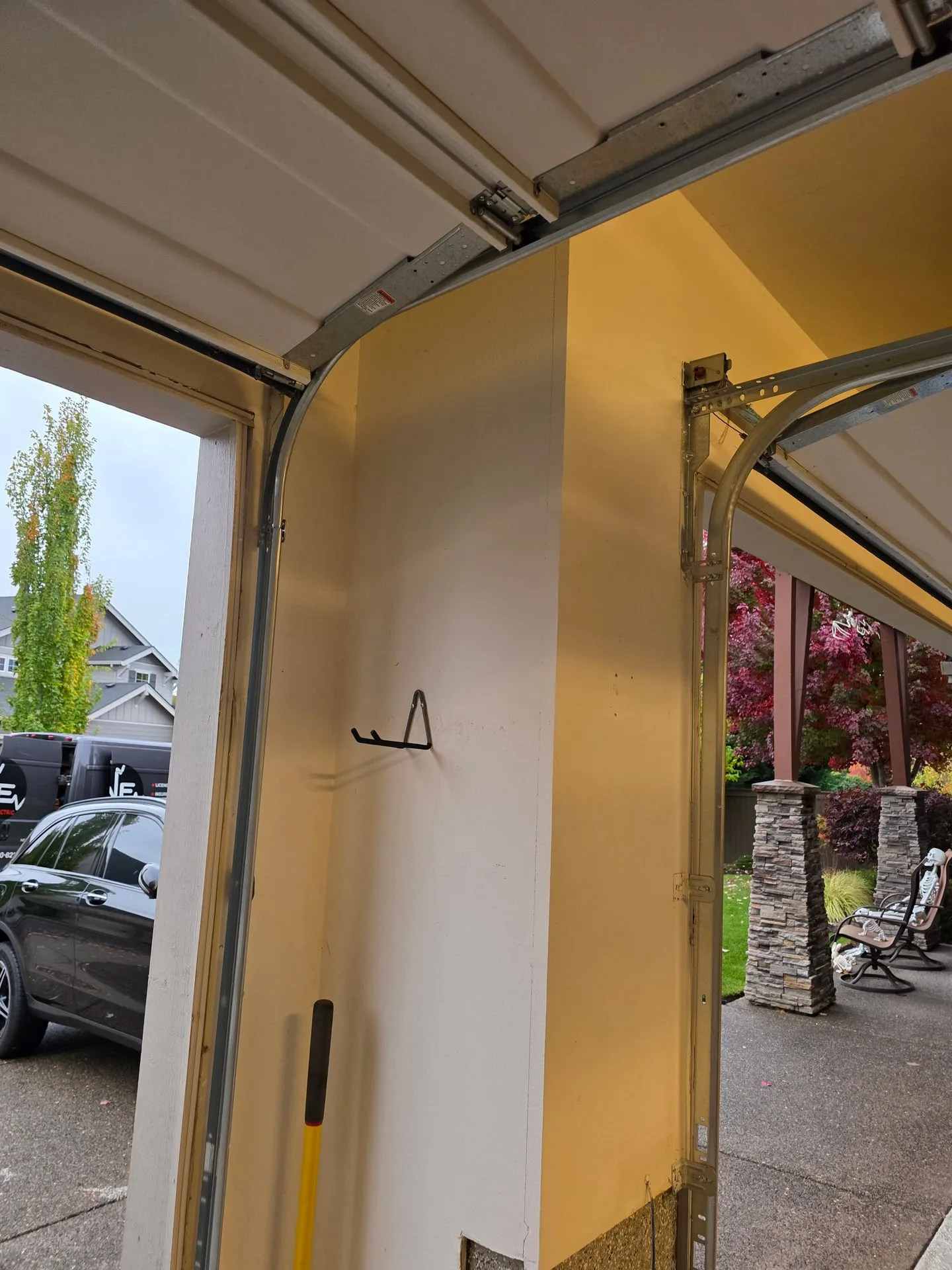 Empty garage wall beside the garage door track in a Vancouver WA home before a Tesla Wall Connector was mounted