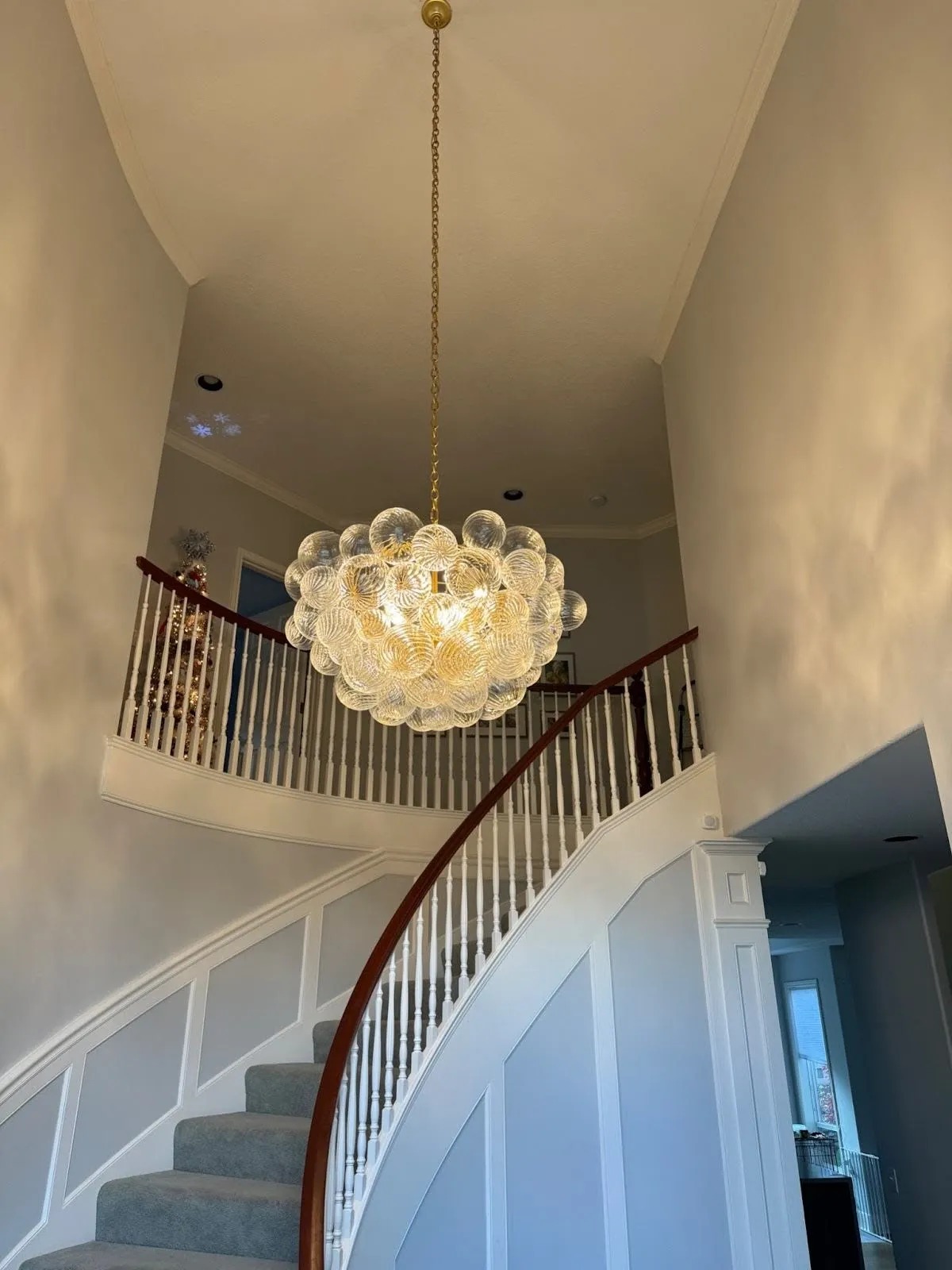 Modern chandelier in a Vancouver WA home foyer installed by Newman Electric