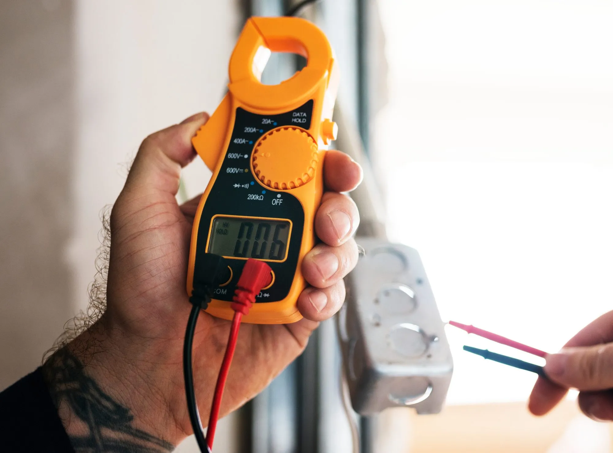 Newman Electric electrician working at a residential panel