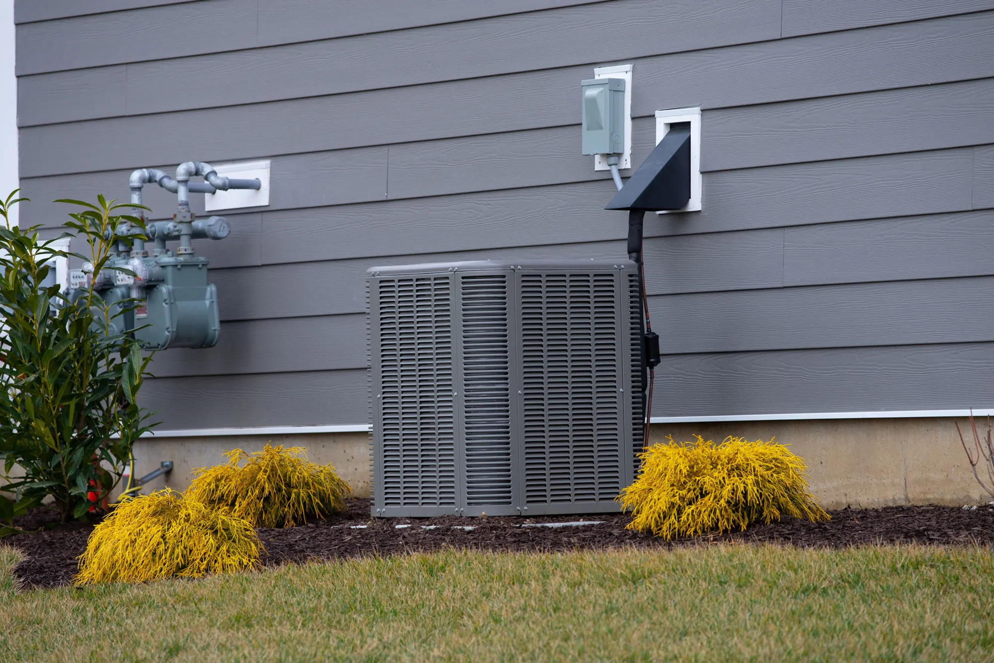 Residential heat pump condenser with electrical disconnect installed by Newman Electric in Vancouver WA