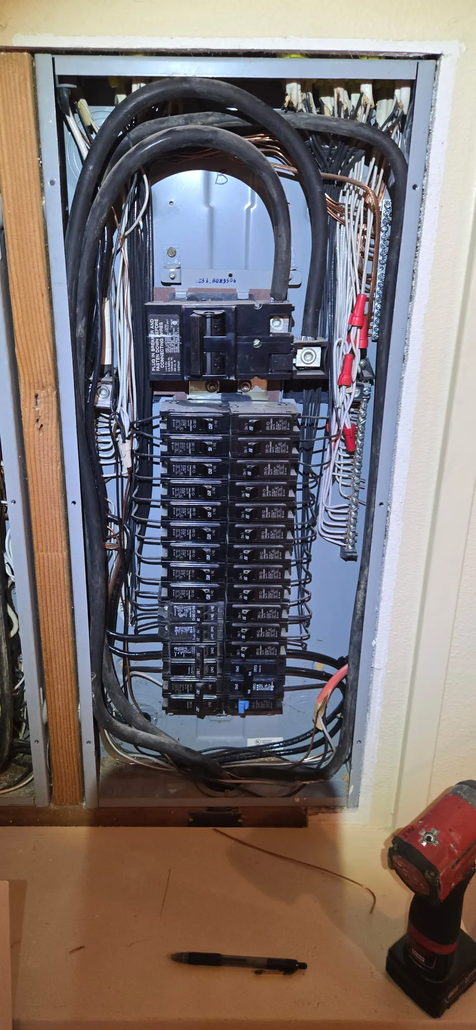Electrical panel in a Brush Prairie WA home after correction work, with each breaker landed on a single conductor, the neutral bar secured, and spare wires capped off