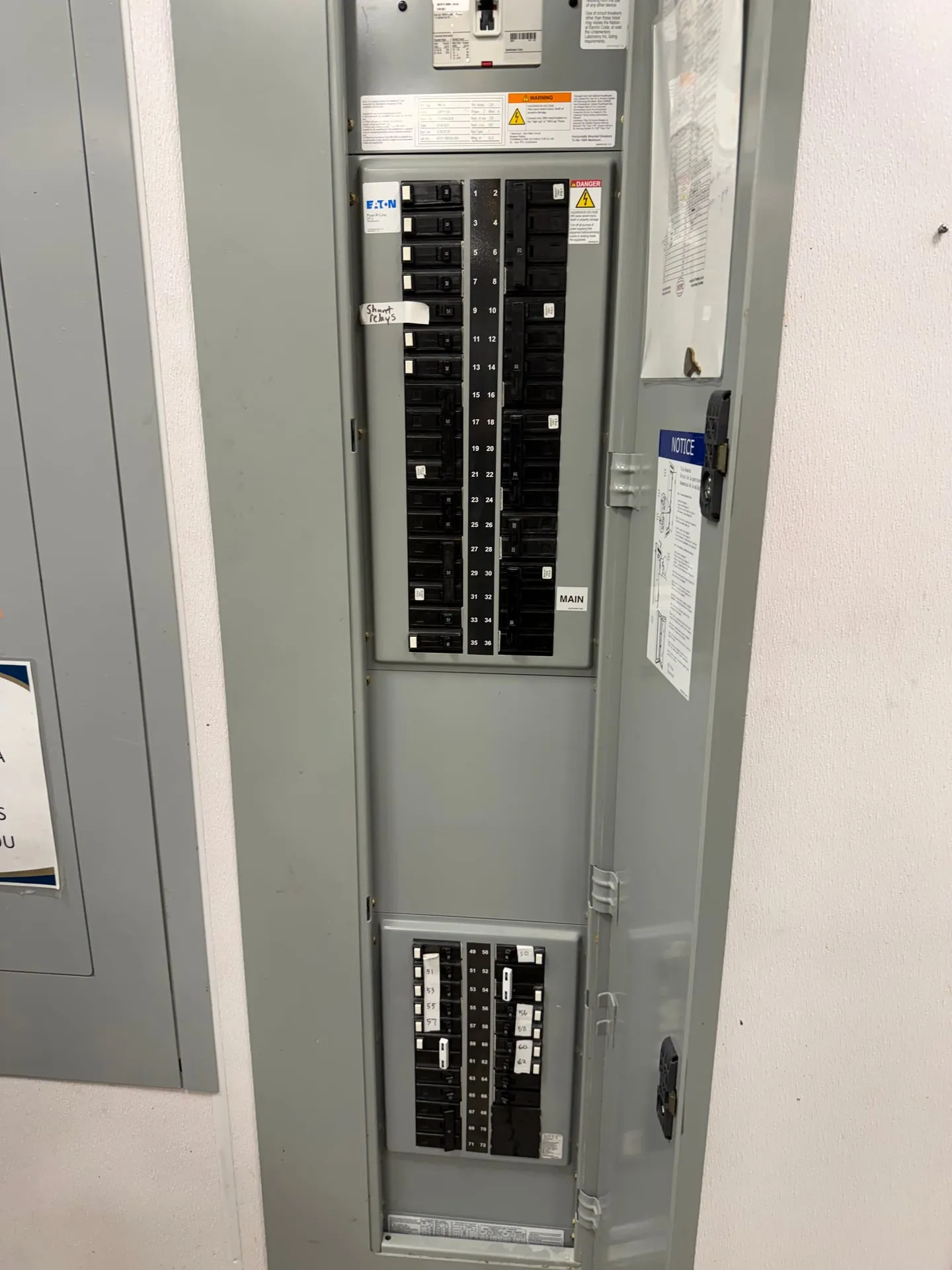 Commercial panelboard with the door open in a Ridgefield WA restaurant, where the new 20-amp GFCI breakers went in