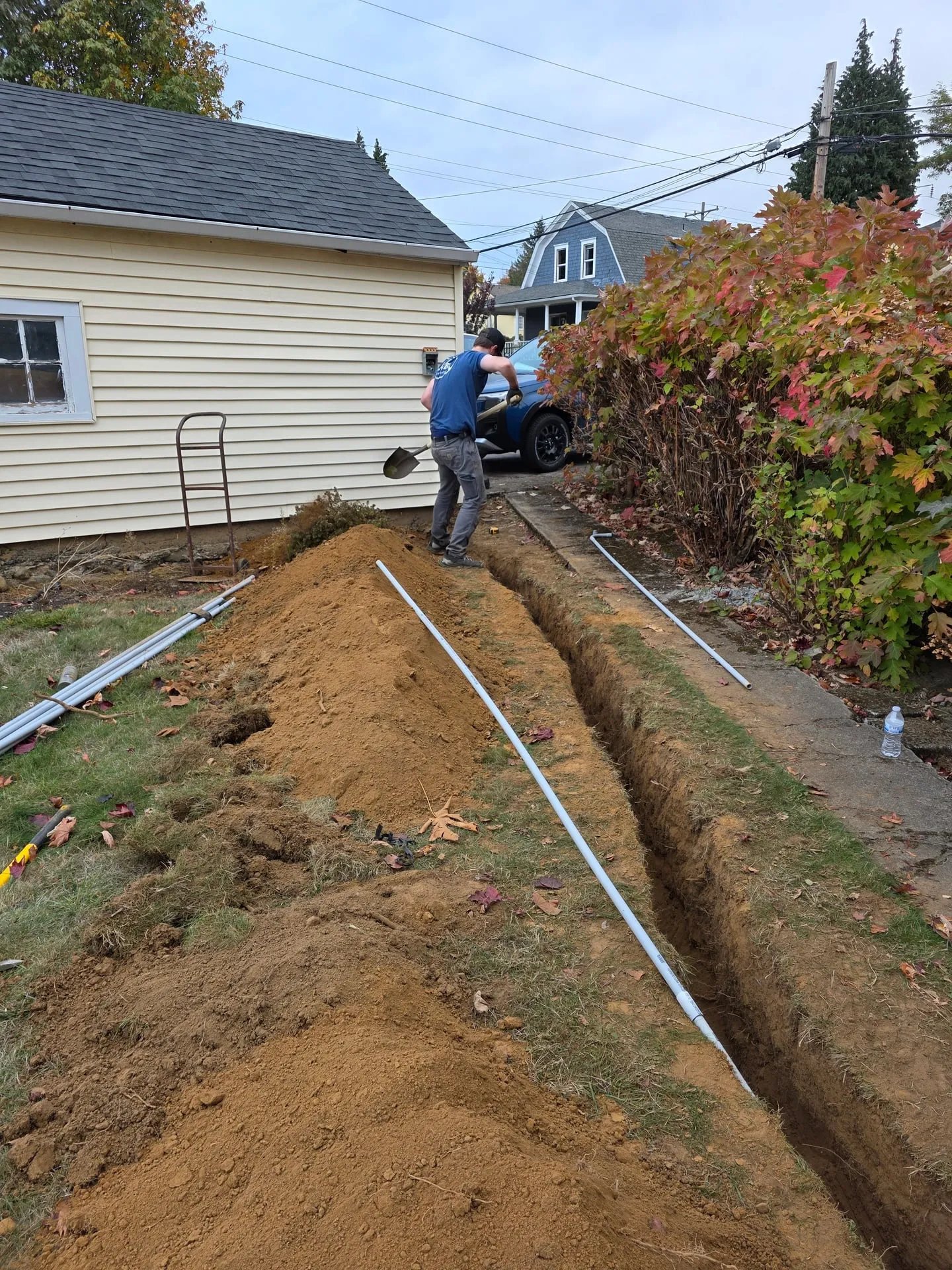 PVC conduit laid in a long trench along a side yard toward a detached garage in Washougal WA