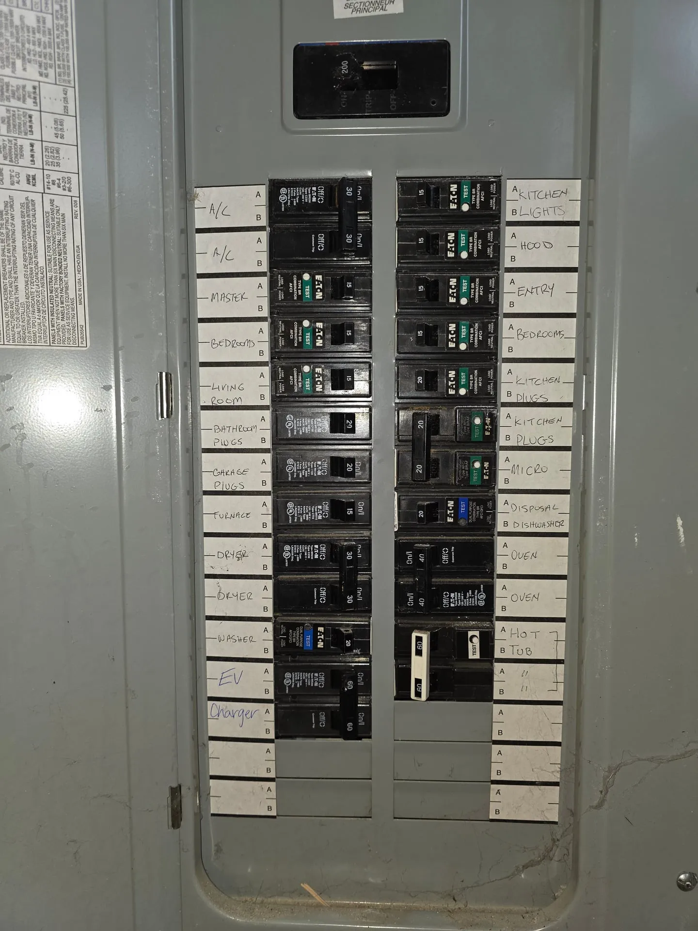 Inside an Eaton panel in a Vancouver WA garage with a new breaker added for an EV charger