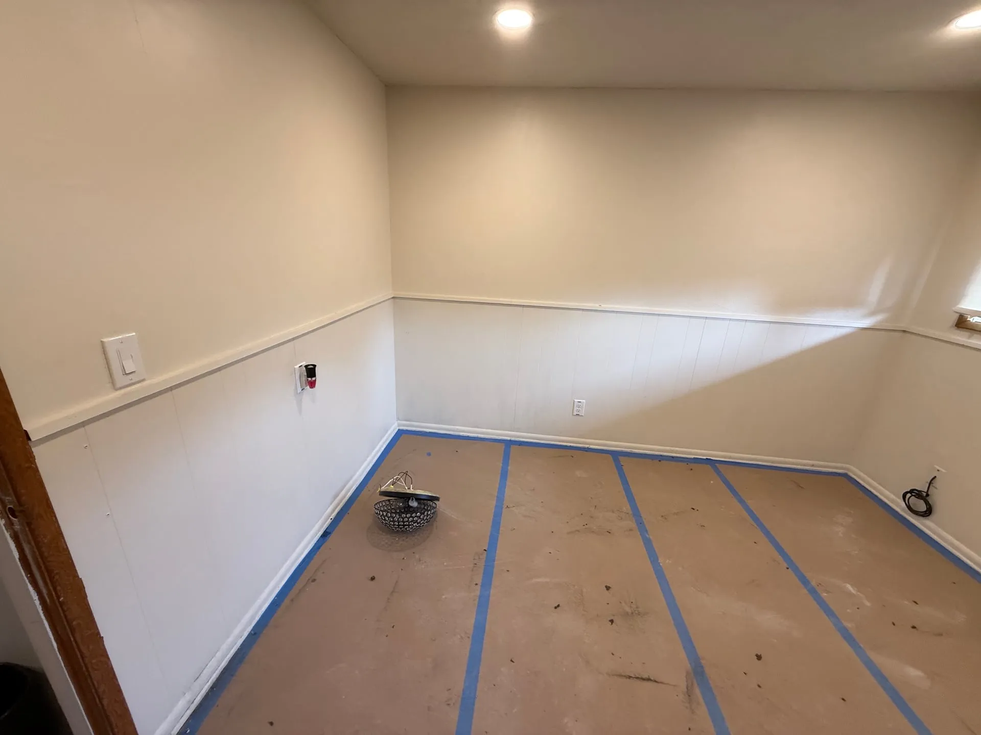 Bedroom wall in a Hazel Dell home in Vancouver WA showing a relocated outlet and switch during the lighting and receptacle update