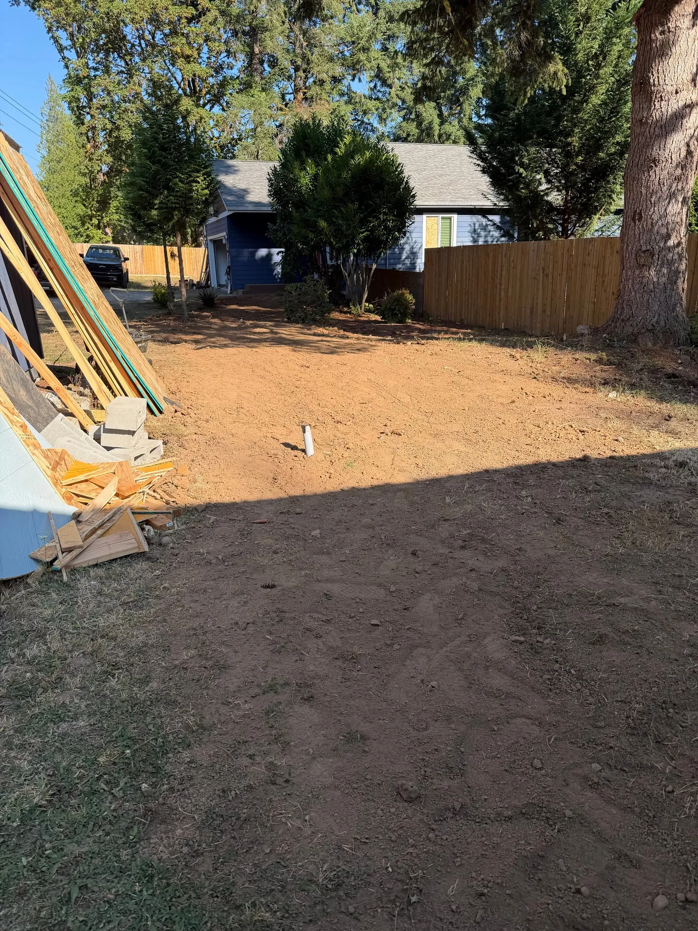 Backyard of a rural Woodland WA home graded flat and restored after an underground electrical feeder trench was backfilled